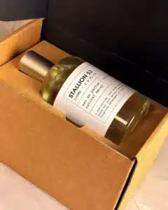 Perfume bottle packaged in cardboard box