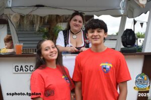Smiling group at Oktoberfest Miami 2025 booth