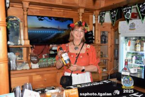 Oktoberfest Miami bartender holding Cloakroom label bottle