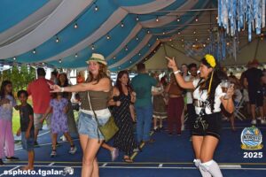 People dancing at Oktoberfest Miami 2025 celebration.