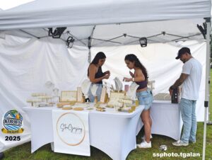 People browsing jewelry at outdoor Oktoberfest Miami.