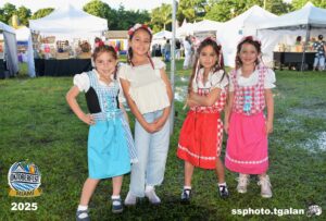 Children in festive attire at Oktoberfest Miami, 2025.