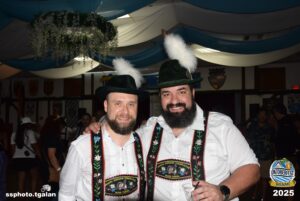 Friends in traditional Bavarian outfits at Oktoberfest Miami.