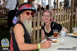 Couple enjoying food at Miami Oktoberfest 2025.