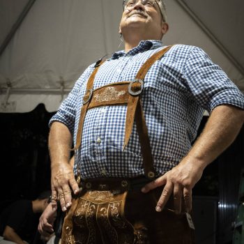 Man in lederhosen and checked shirt.